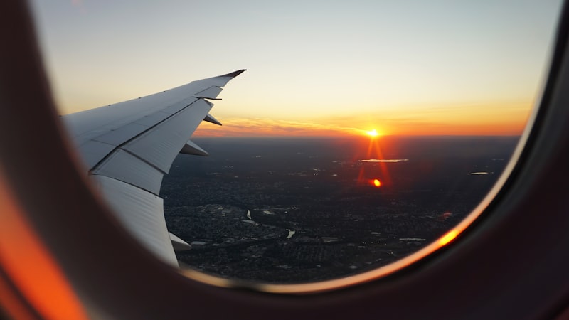 Airplane wing at sunset